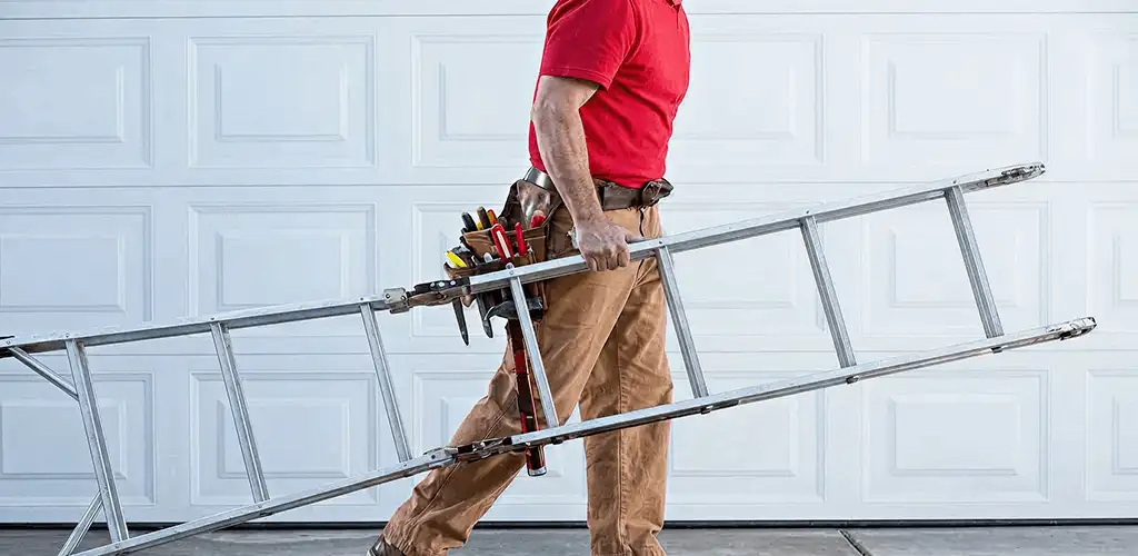 Garage door repair technician arriving with tools and ladder in Columbus, GA