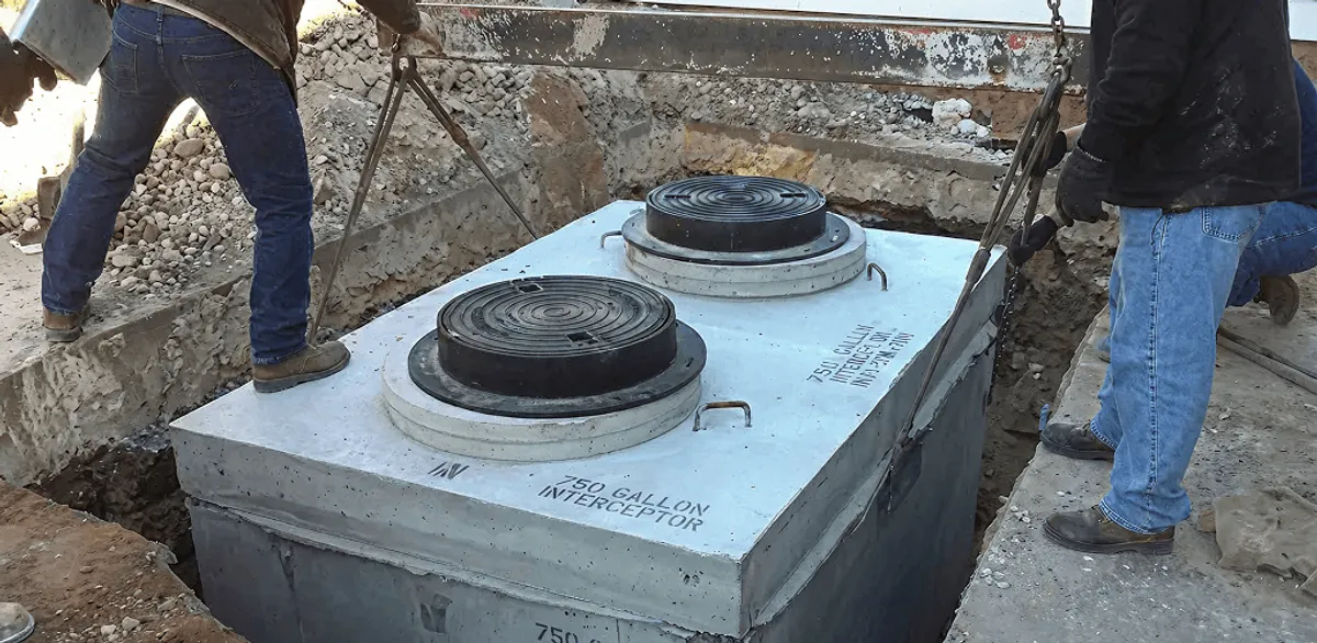 Grease trap installation for a commercial property drainage system in Columbus, GA