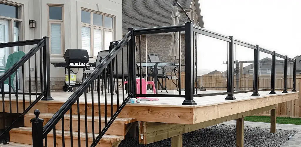 Handrail installation on a deck staircase for safety and code compliance in Columbus, GA